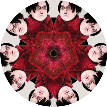 This mandala was made from a self portrait of myself modeling a scarf I knit.