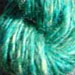 An equal blend of blue, green, and yellow corriedale roving hand carded.